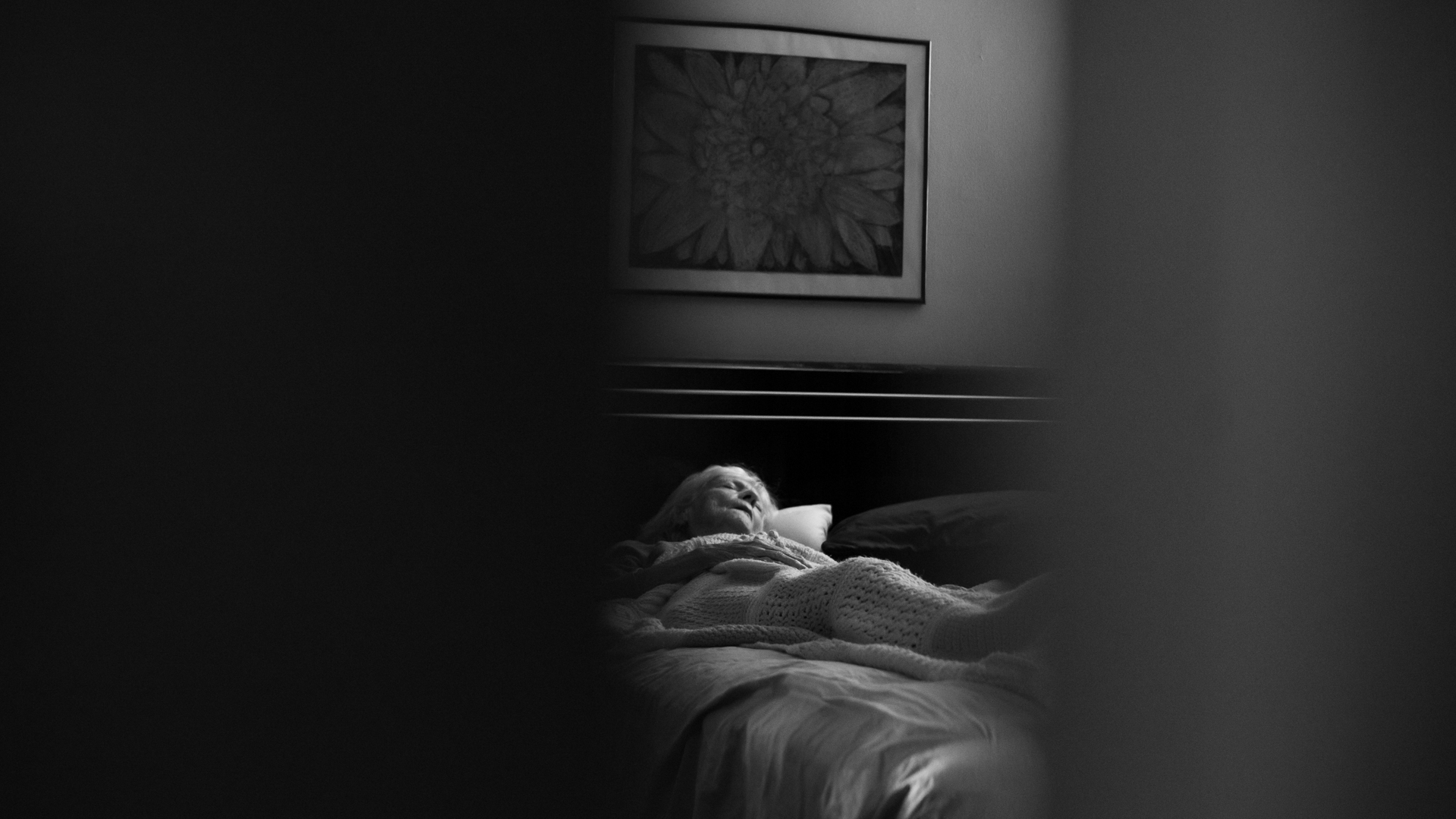 A woman alone in bed